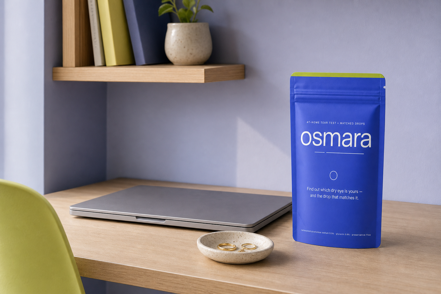 The osmara pouch and the supplied dropper on a pale bedside shelf beside reading glasses in morning light